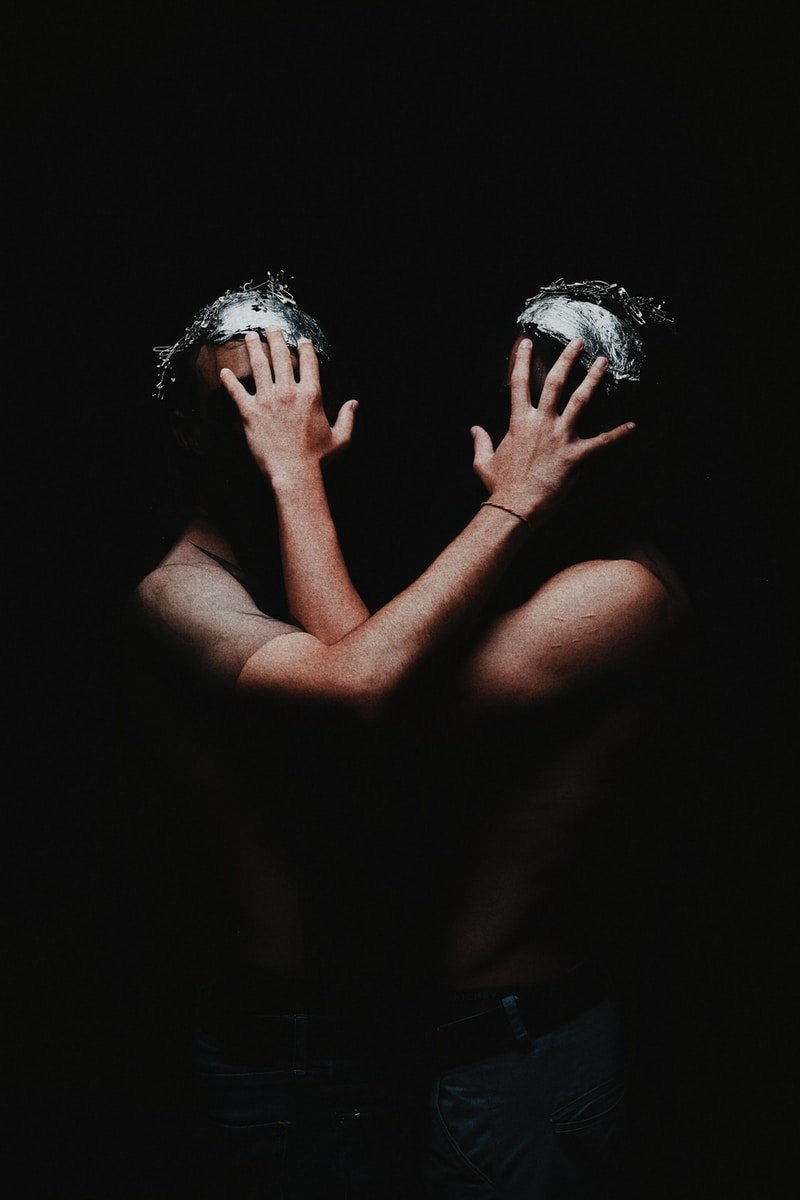 two human hand covering both human faces art